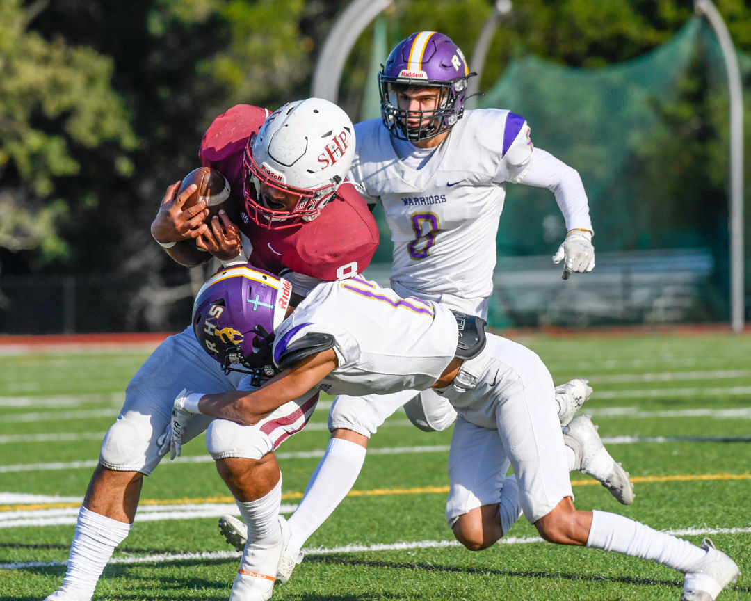 Elroy Perez (12) tackles Andrew Latu (8) at the CIF 5-A State Championship Game